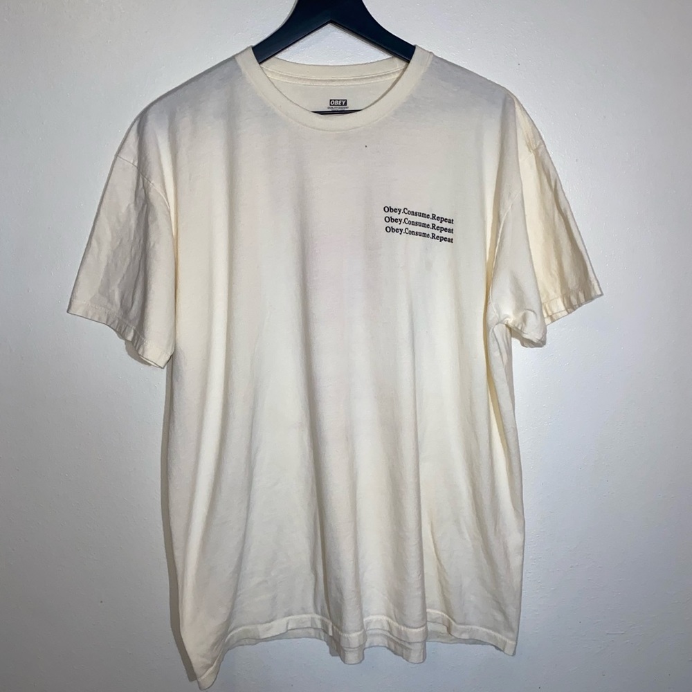 Obey Off-white Colored Short Sleeve T-shirt With Pink Graphic On Back Size XL